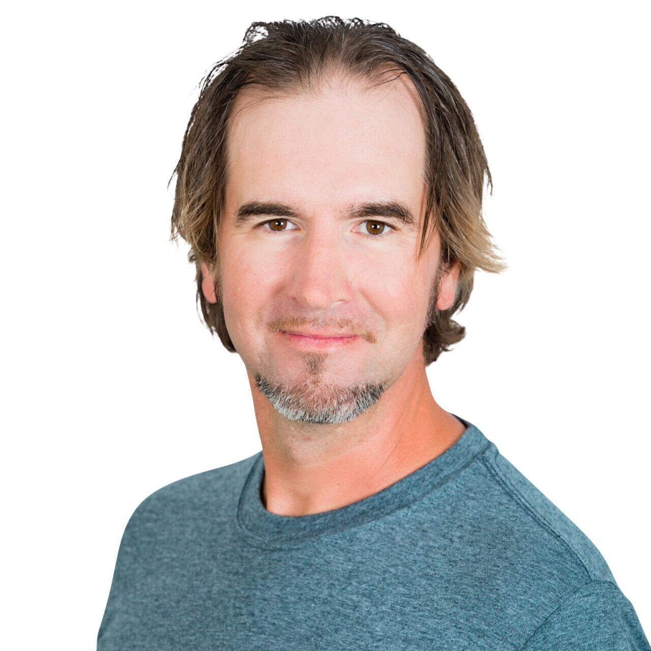 A person with a slight smile wears a blue "Whispering Pines Landscaping" t-shirt, set against a white background.
