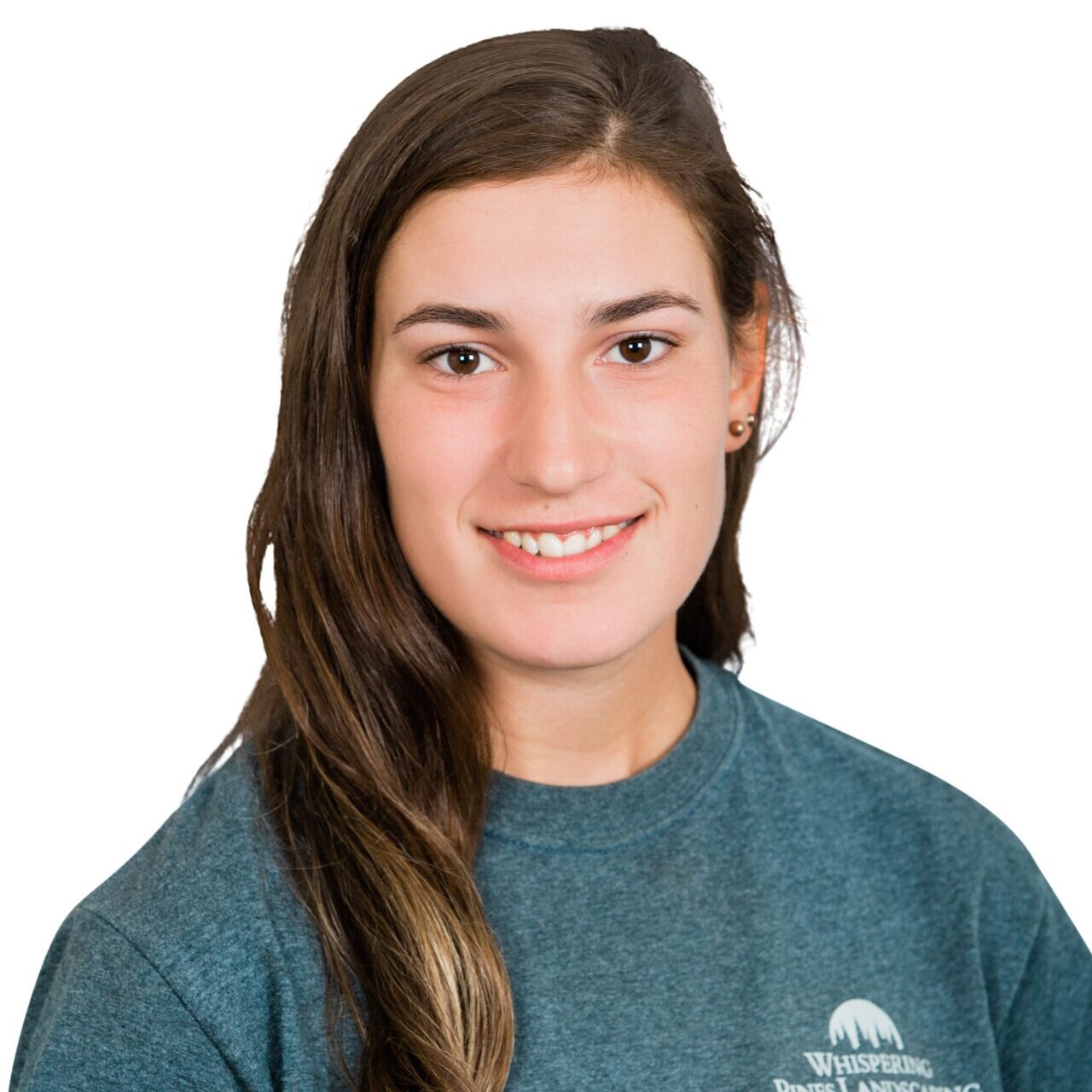 A person with long hair is wearing a blue shirt that says "Whispering Pines Landscaping." The background is plain white.